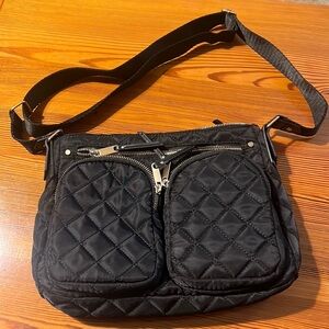 Nylon black purse with lots of pockets and zips